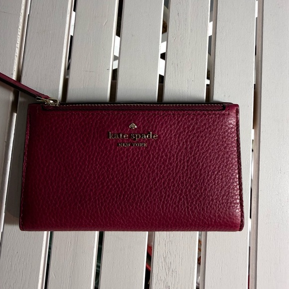 kate spade Handbags - Kate Spade  Leila Slim Bifold leather walllet Burgundy